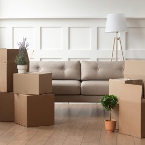 Moving,Day,Concept,,Cardboard,Carton,Boxes,Stack,With,Household,Belongings